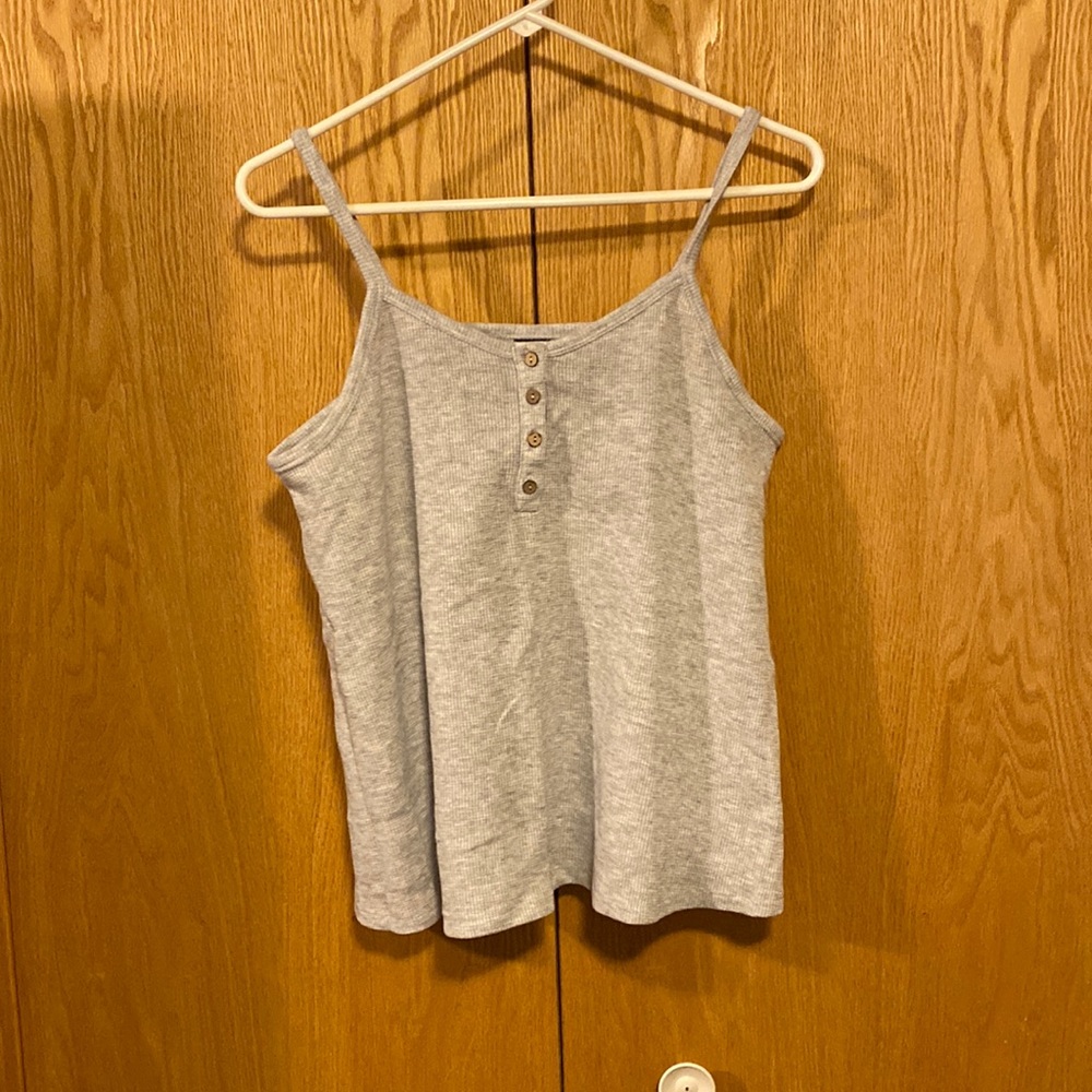 Girls art class tank size XXL could fit a woman’s small